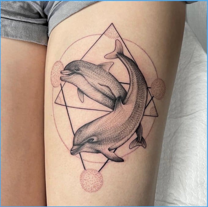 dolphin sister tattoos with geometrical shape
