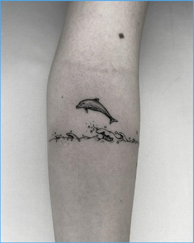 Matching dolphin tattoos by jizottt  Tattoogridnet