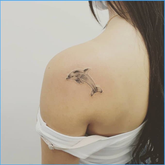 dolphin tattoo on back of neck