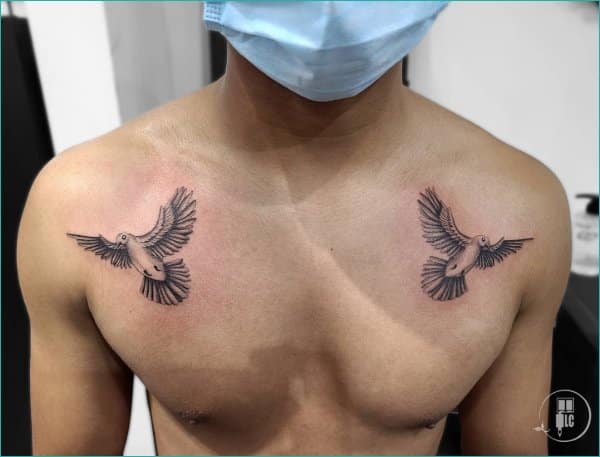 dove tattoos with clouds on chest