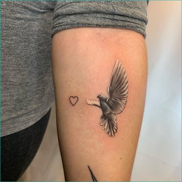 small simple outline red heart and dove tattoo on wrist  EntertainmentMesh