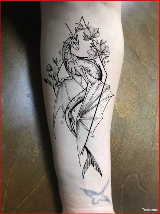 girl with dragon tattoo on arm