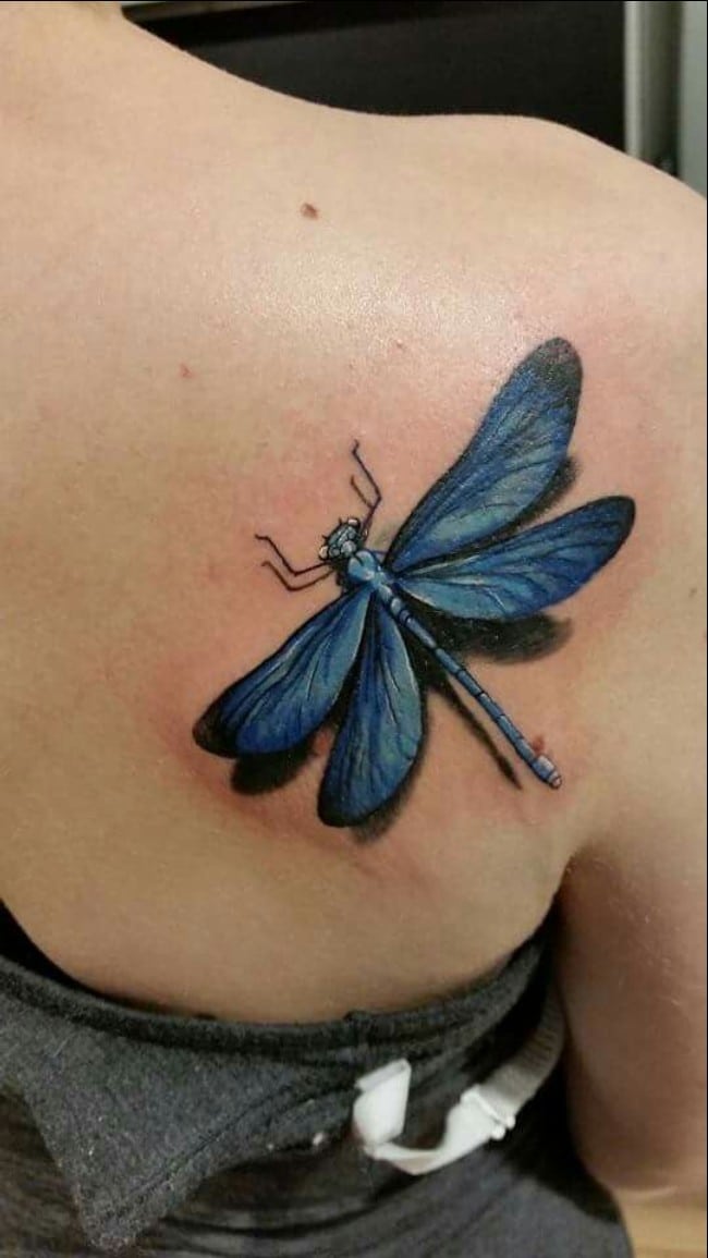 dragonfly tattoo on upper back