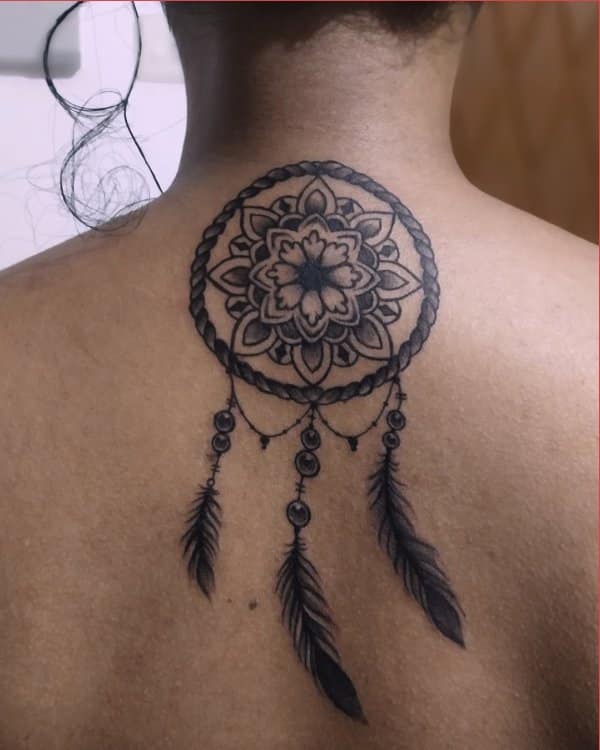 dream catcher tattoo upper back