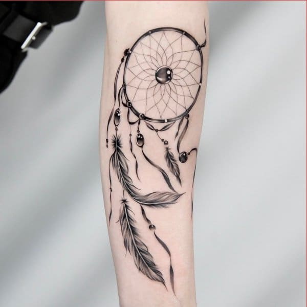 dreamcatcher tattoo on inner arm