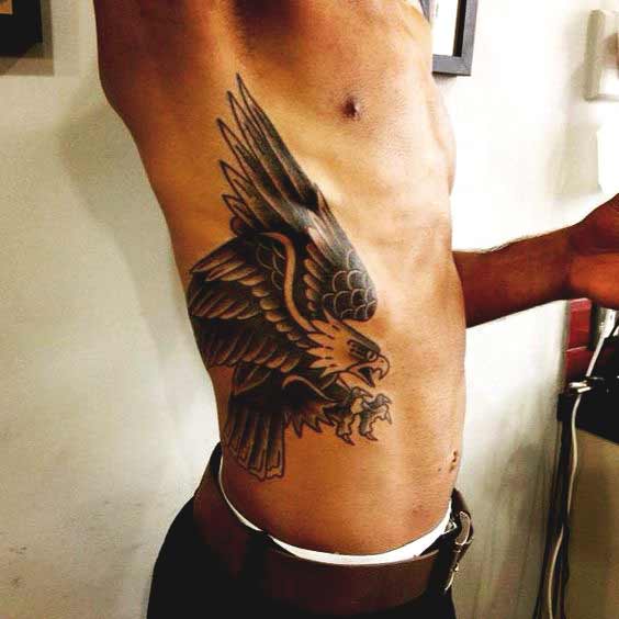 Flying eagle tattoos on ribs