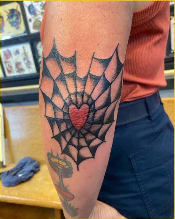 spider web tattoos on elbow