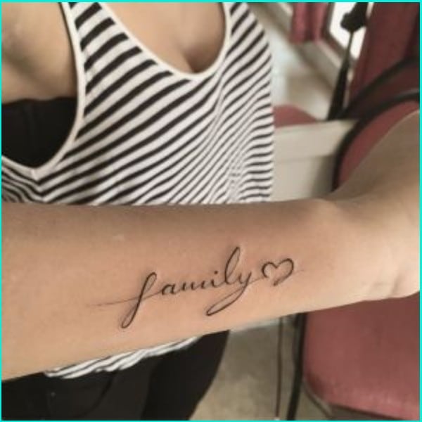 family word tattoo with small heart