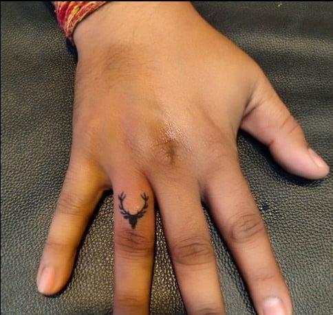 Small deer finger tattoos