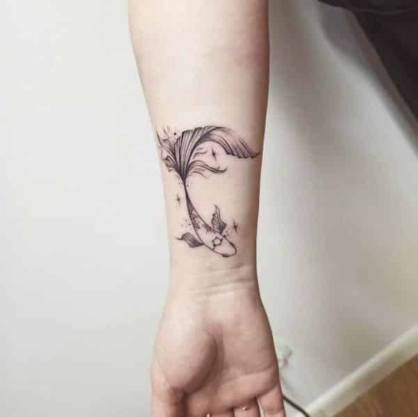 fish tattoos on wrist
