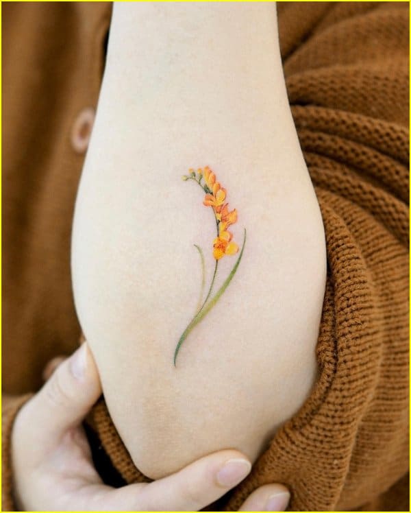 lavander flower tattoos on forearms