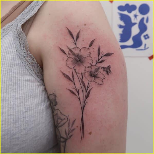 Hibiscus flower tattoo on upper half sleeve