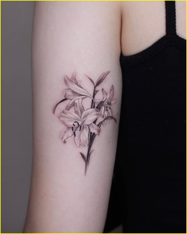 lily flower tattoo back of arm