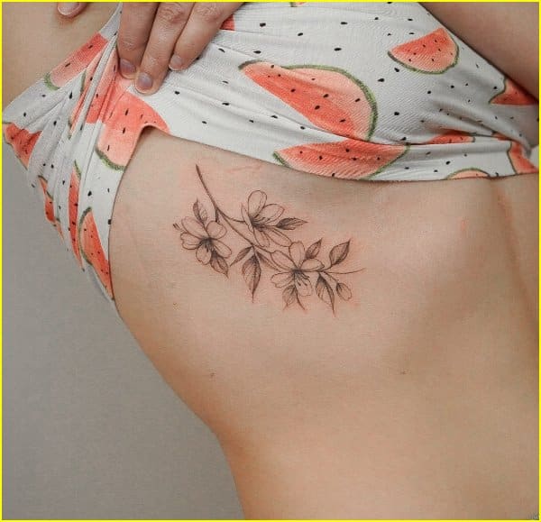 lily flower tattoos under breast