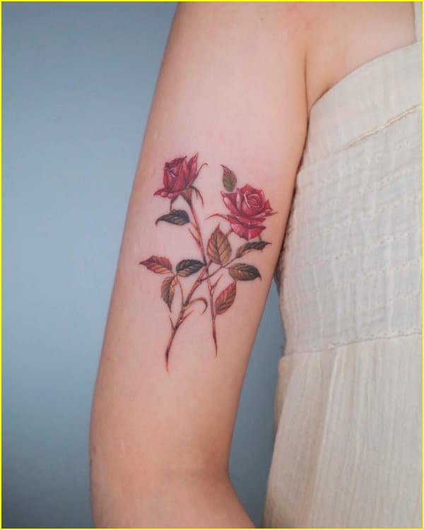 2 flowers with names by Joshua Hibbard TattooNOW