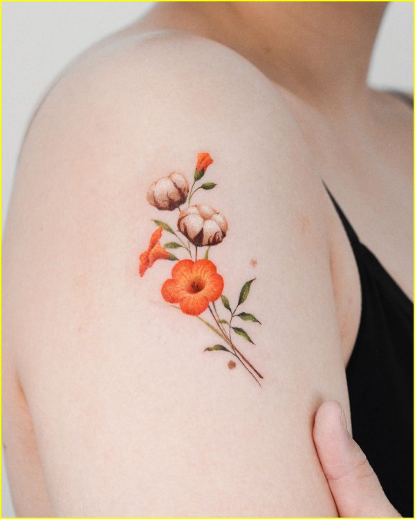 thistle flower tattoo on arm