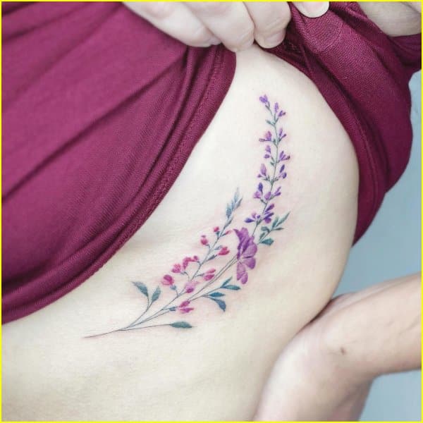 flower tattoo on side rib cage