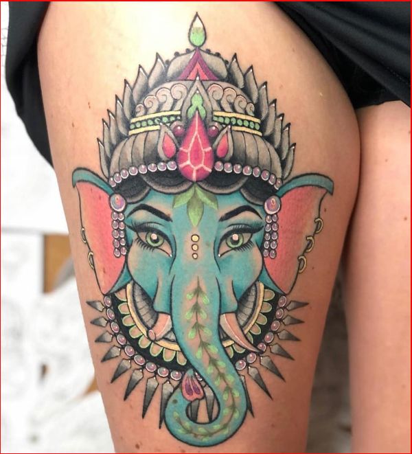 ganesha tattoo on thigh with color