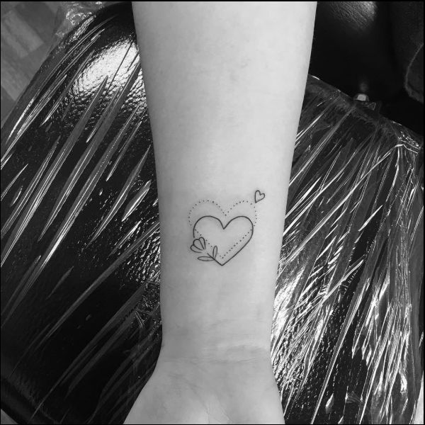 small heart on wrist tattoo