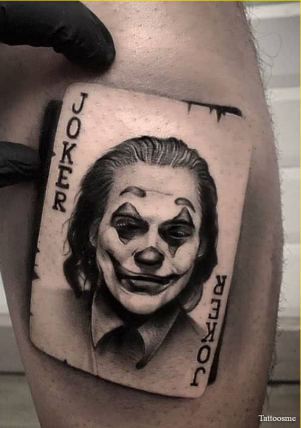 joker face tattoo on cards