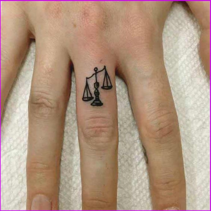 small libra tattoos on finger