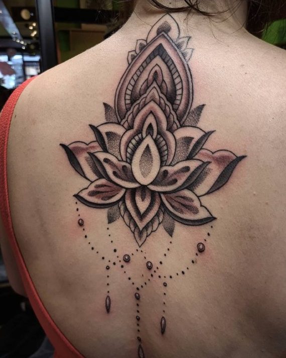 purple color lotus tattoos on back