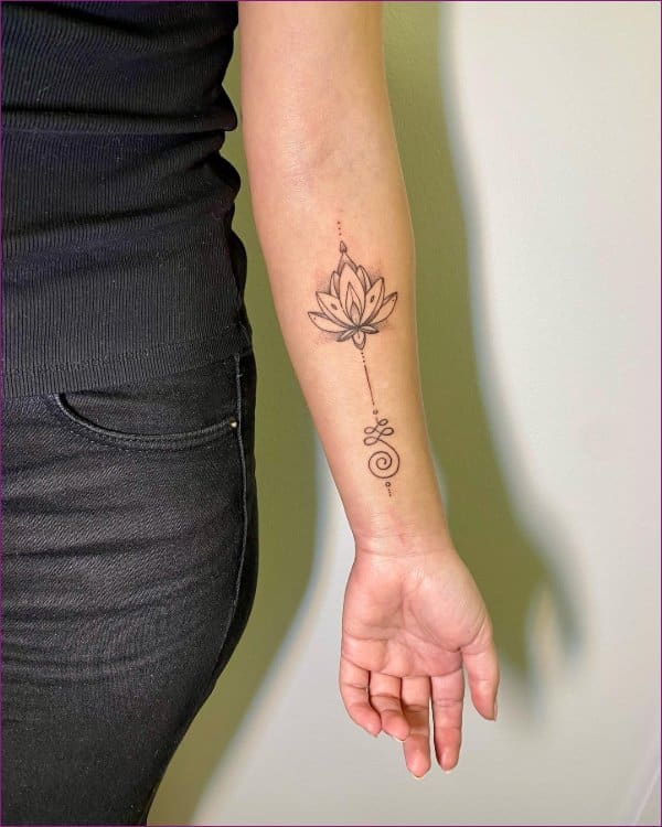 Lotus flower tattoo on the left wrist