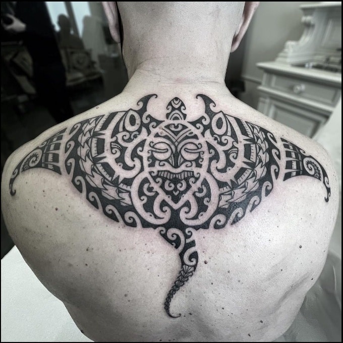 Manta ray maori style tattoo on back