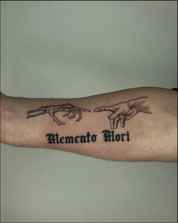 memento mori tattoo bicep