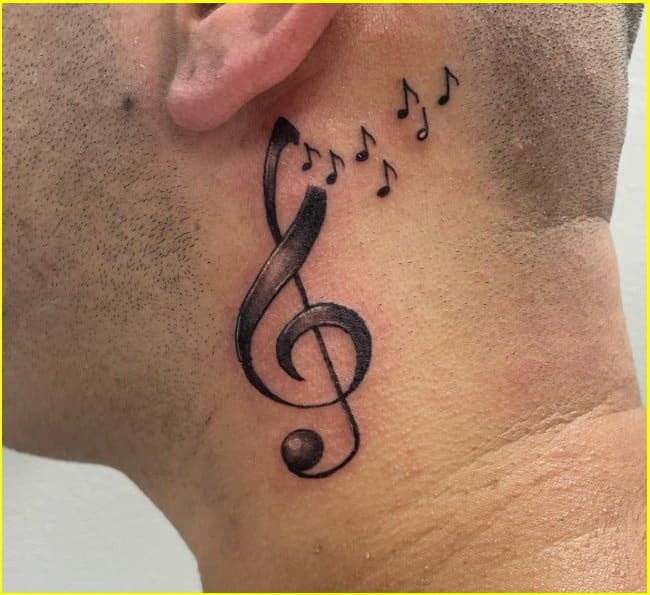behind the ear music tattoo