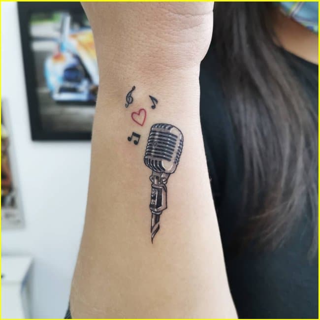 musical note tattoos with headphones and microphone