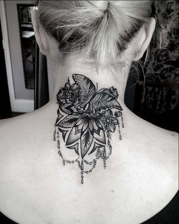 Mandala butterfly tattoo on back of neck