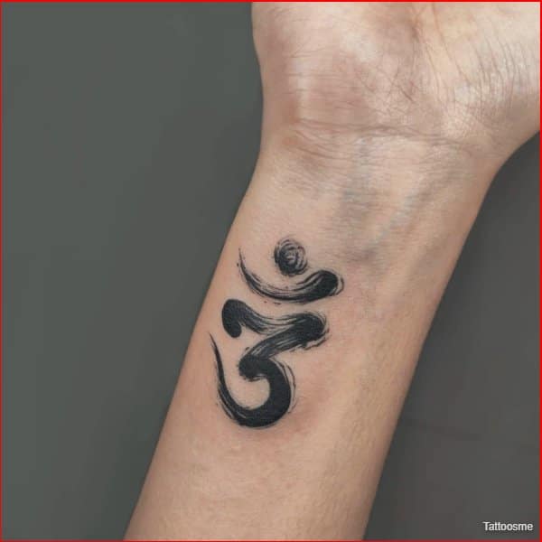 om tattoo on wrist