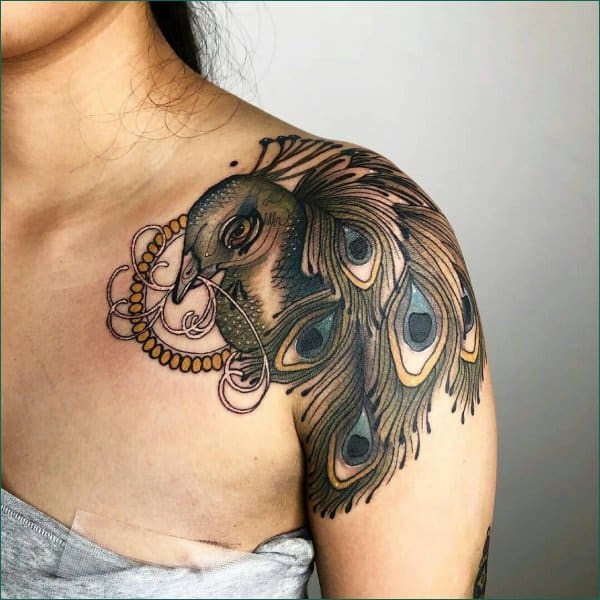 peacock tattoo on collar bone