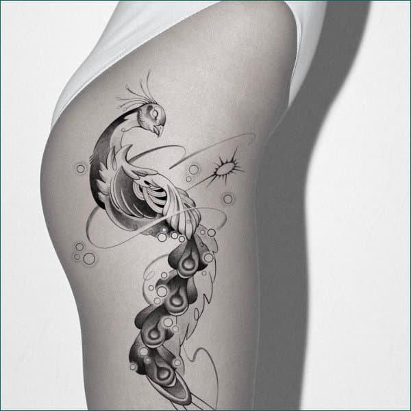 best peacock tattoos on thigh