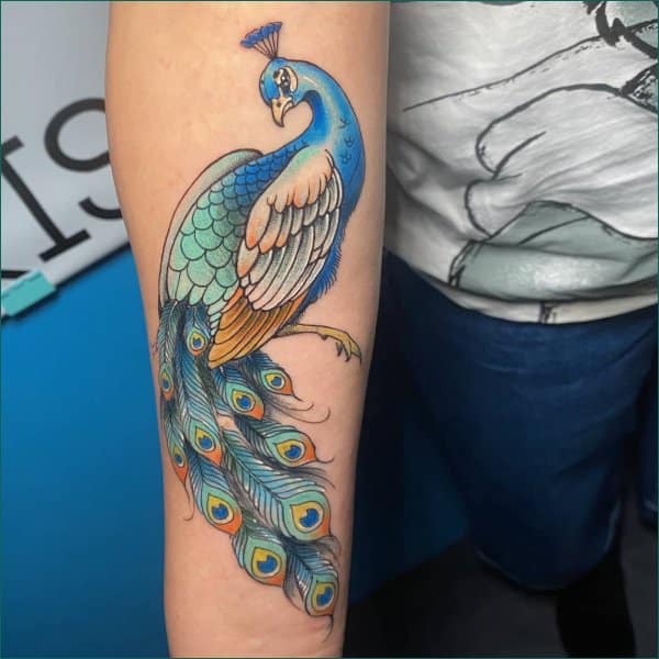 Peacock backpiece tattoo