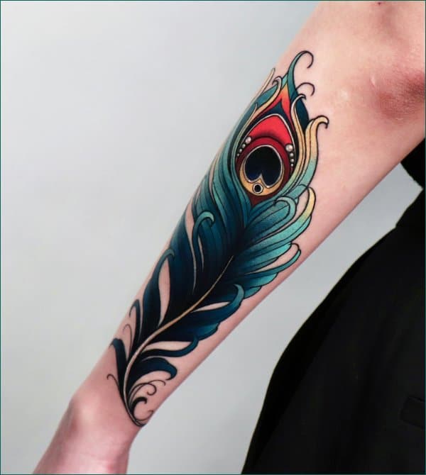 peacock feather tattoo on arm