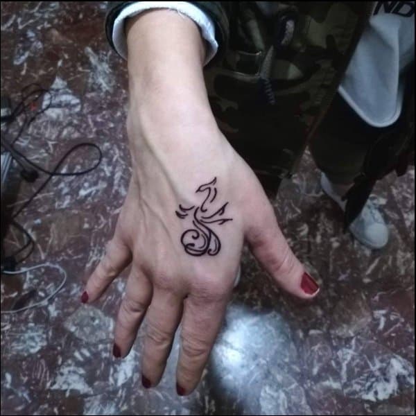 small phoenix tattoo on hand