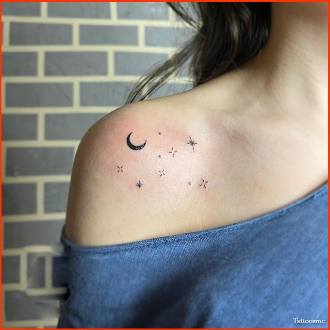 small moon and star tattoo on shoudler