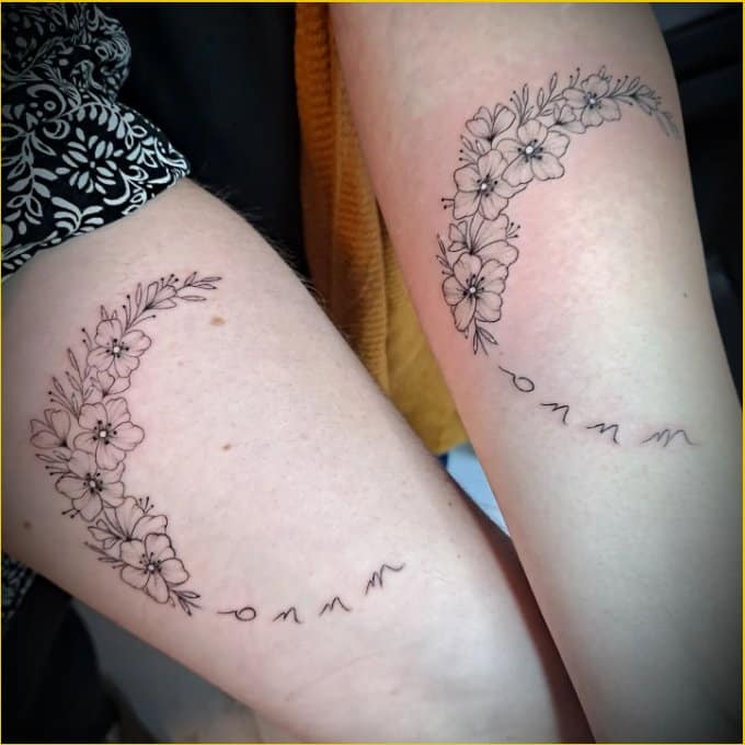 flowers matching sister tattoos