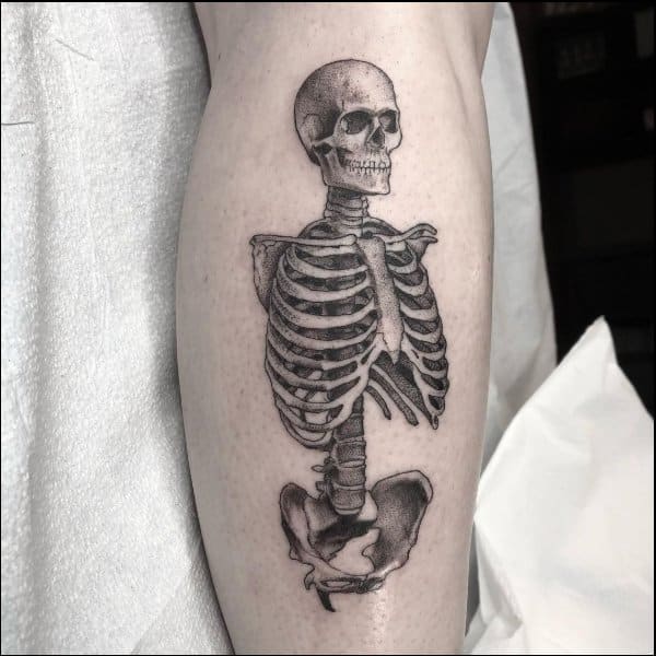 Half skull tattoo on the left forearm  Tattoogridnet