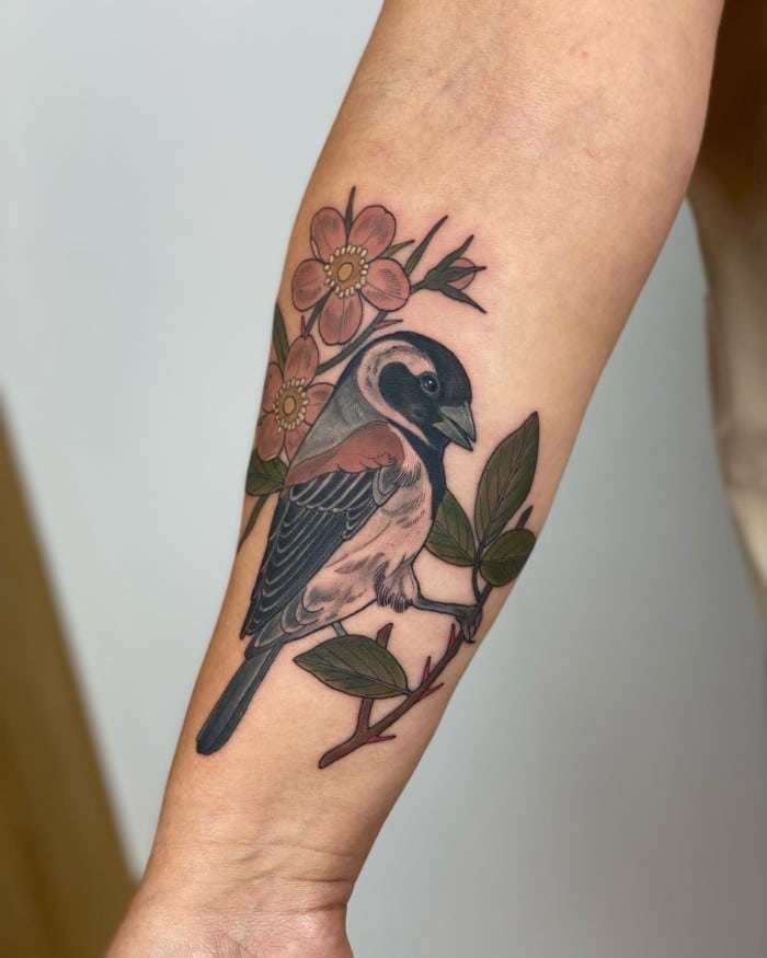 traditional sparrow tattoo on arm