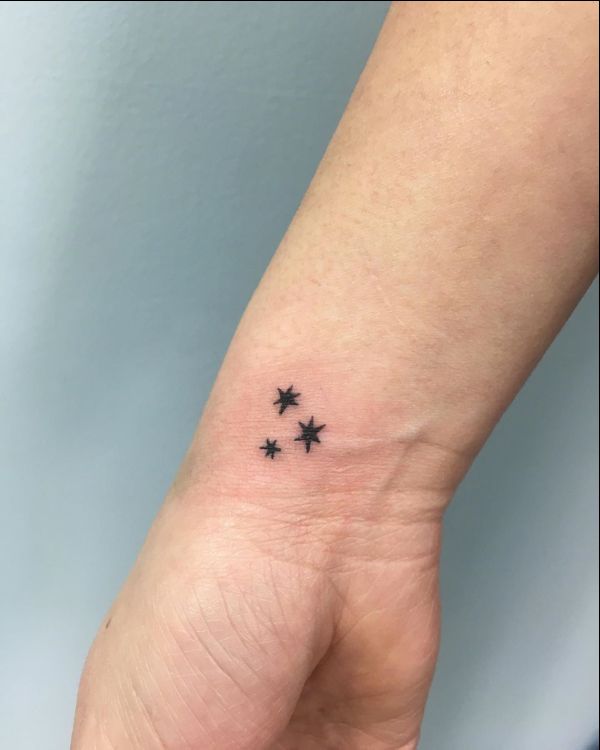 small star tattoo on wrist