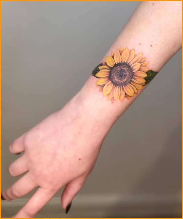 sunflower tattoo on wrist