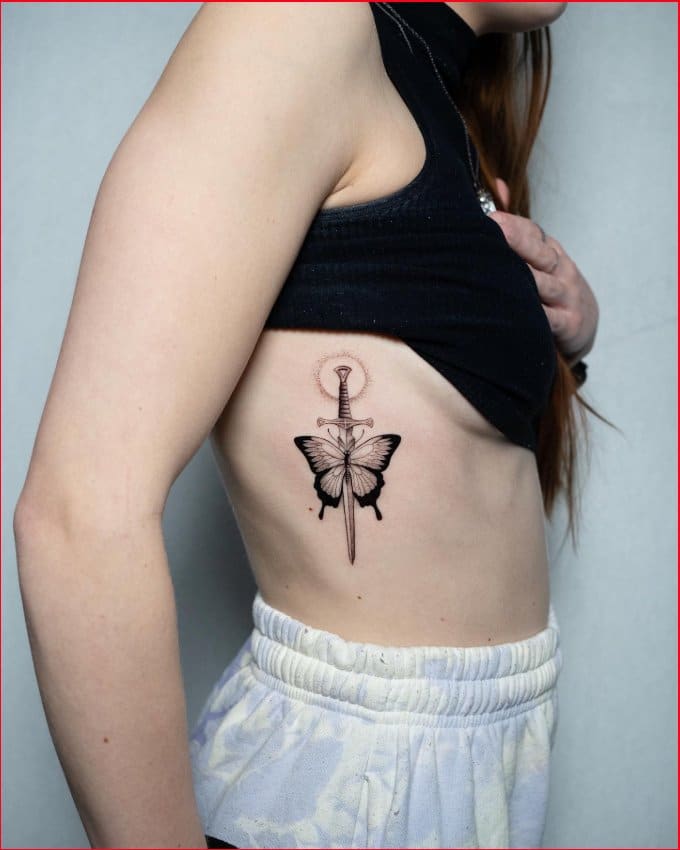ribcage sword tattoo for girls