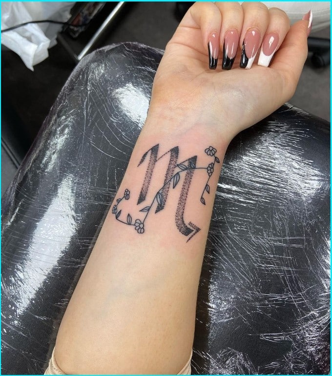 virgo tattoo constellation with symbol on wrist