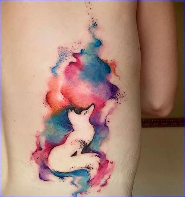 Watercolor fox tattoo on the ankle