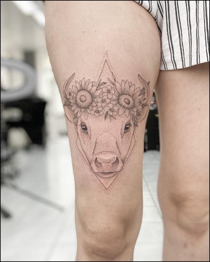taurus tattoo design for girls on thigh