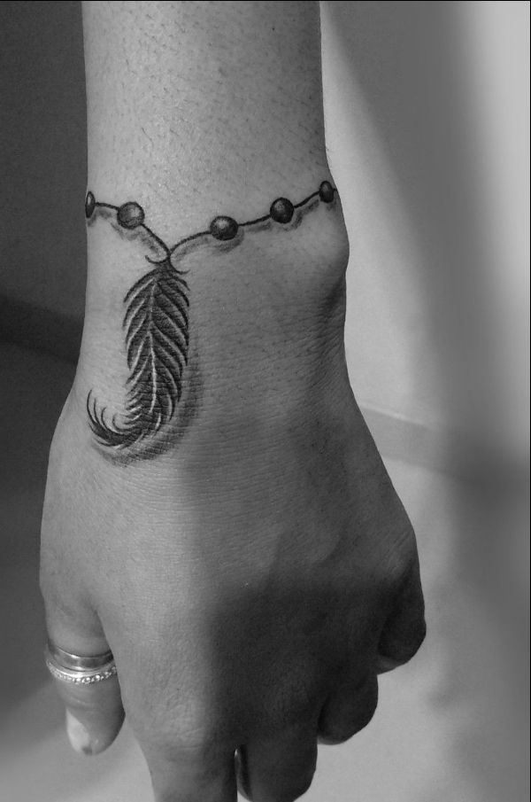 feather tattoos for wrist