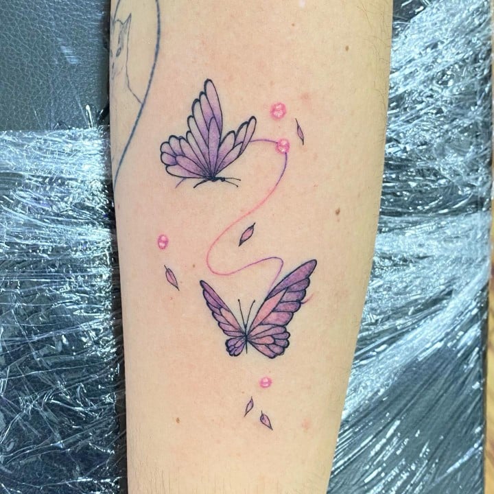 Hand Butterflies tattoo